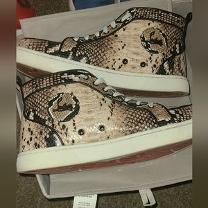 Red bottoms!! Christian Louboutin snakeskin hightop sneakers